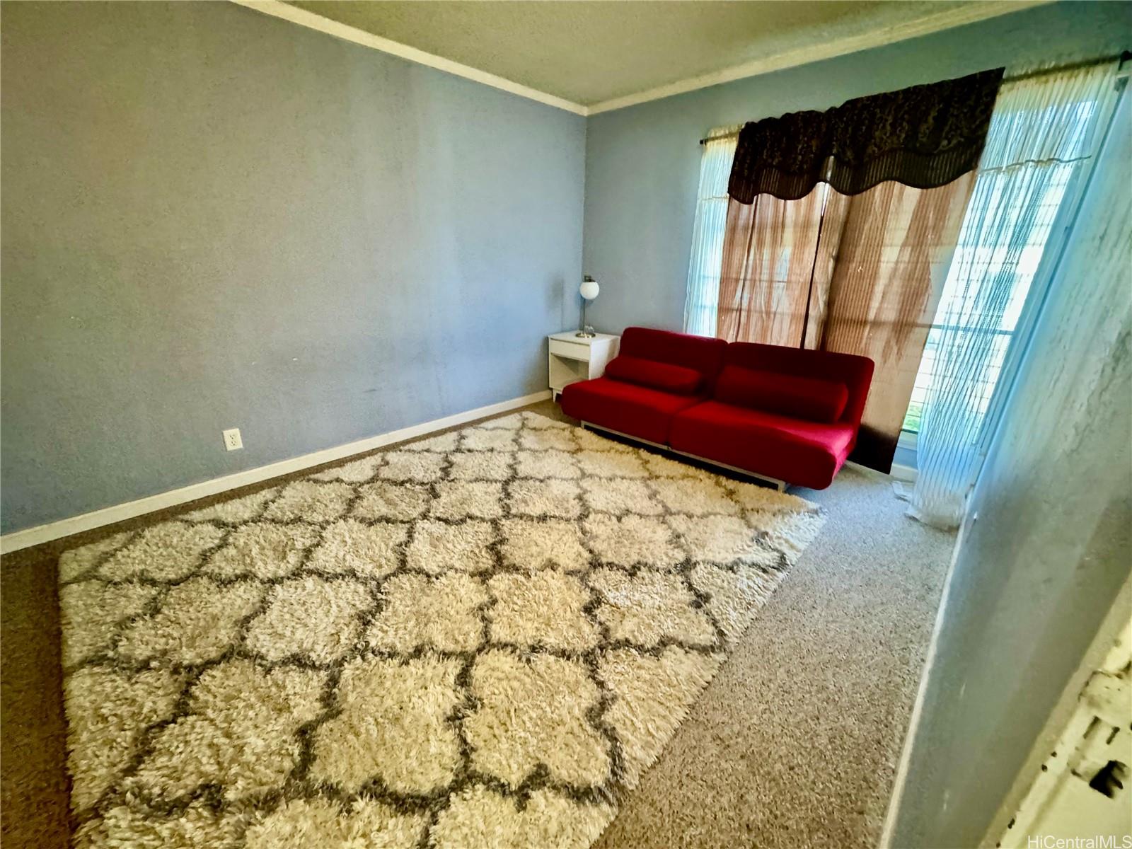 87-122 Helelua Street, Unit C201 Waianae, HI 96792 - Photo 11 of 19 a bathroom with a bathtub and shower curtain