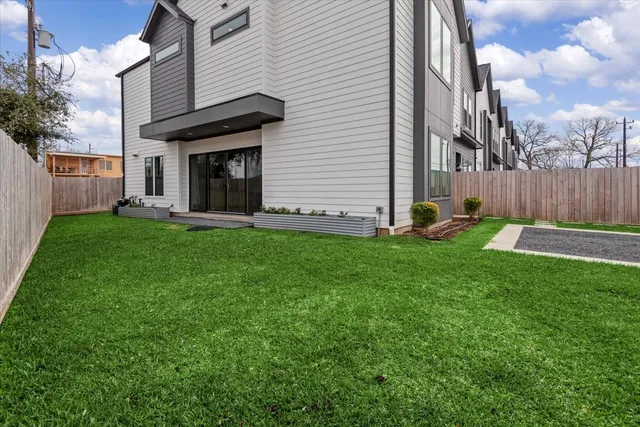 a view of a backyard of the house