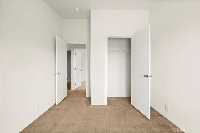 a view of a hallway with washer and dryer
