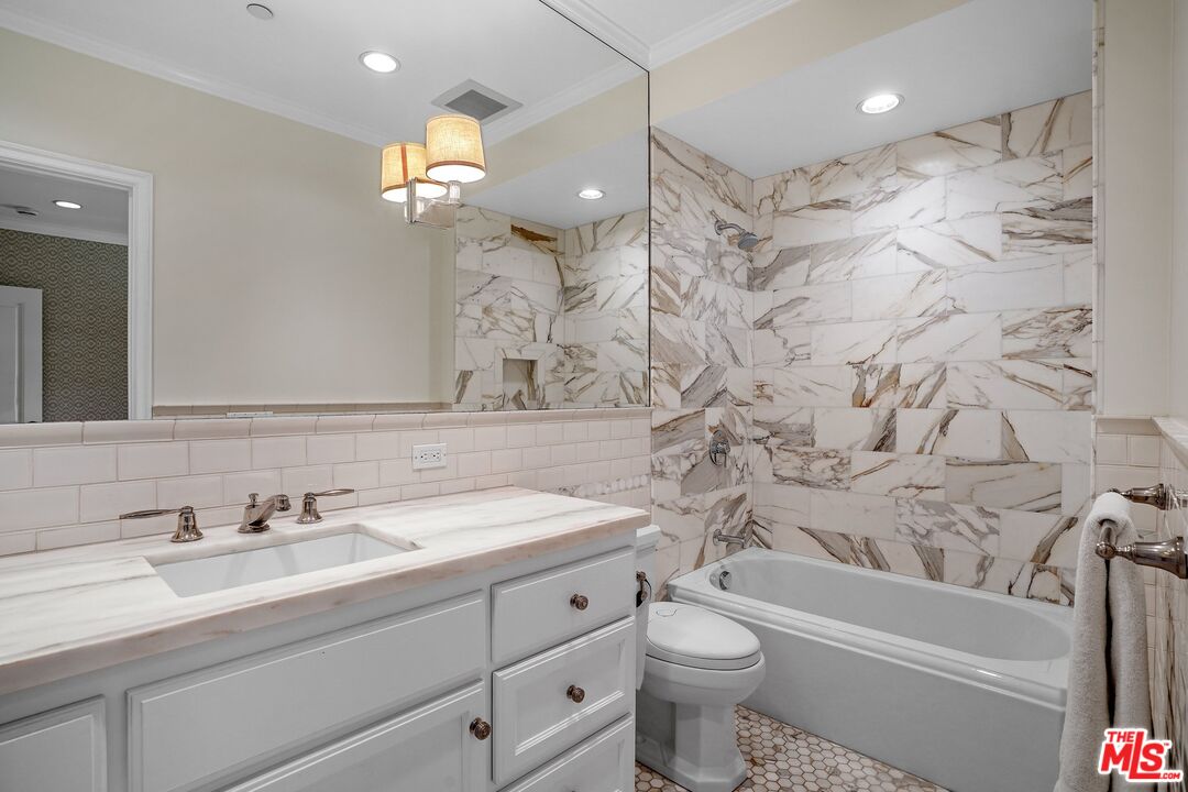 522 21st Street Santa Monica, CA 90402 - Photo 16 of 18 a bathroom with a sink a toilet and a bathtub