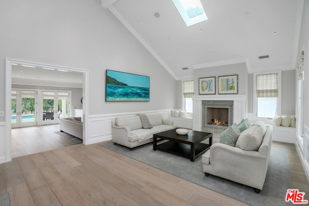 522 21st Street Santa Monica, CA 90402 - Photo 3 of 18 a living room with furniture and a fireplace