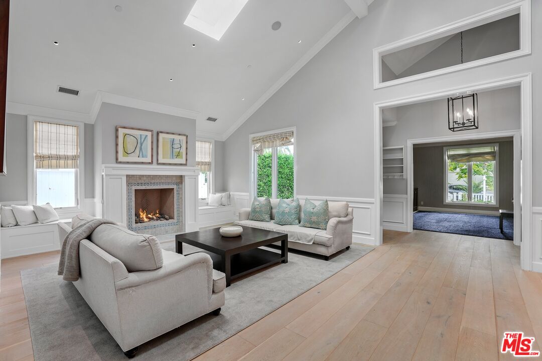 522 21st Street Santa Monica, CA 90402 - Photo 5 of 18 a living room with furniture and a fireplace