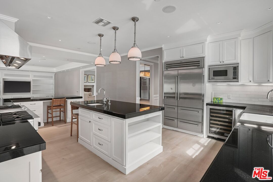 522 21st Street Santa Monica, CA 90402 - Photo 10 of 18 a kitchen with stainless steel appliances a stove a refrigerator a sink a oven and a refrigerator