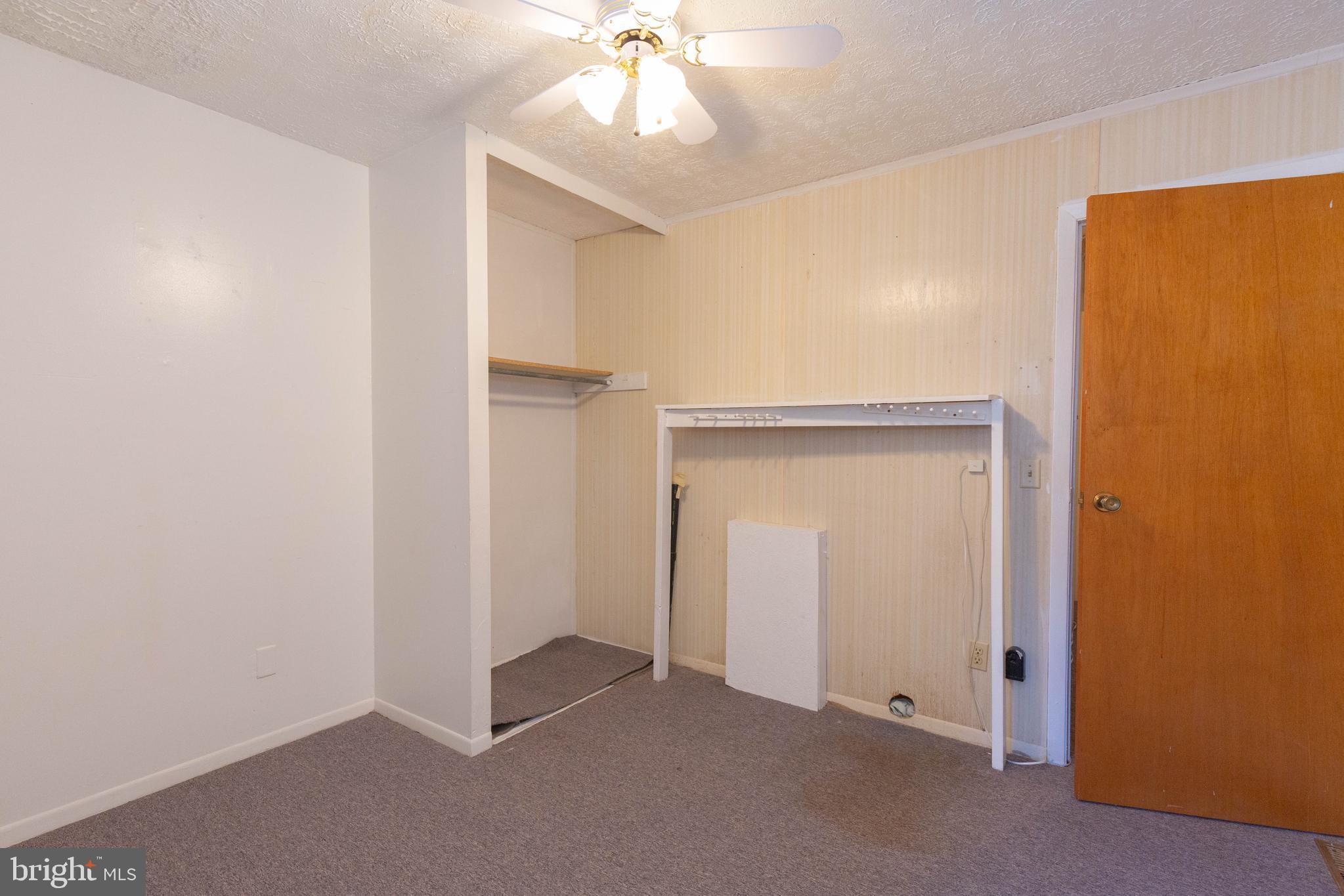 48 Turf Lane Ranson, WV 25438 - Photo 15 of 21 an empty room with closet and a chandelier fan