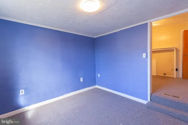 an empty room with a empty space and a window