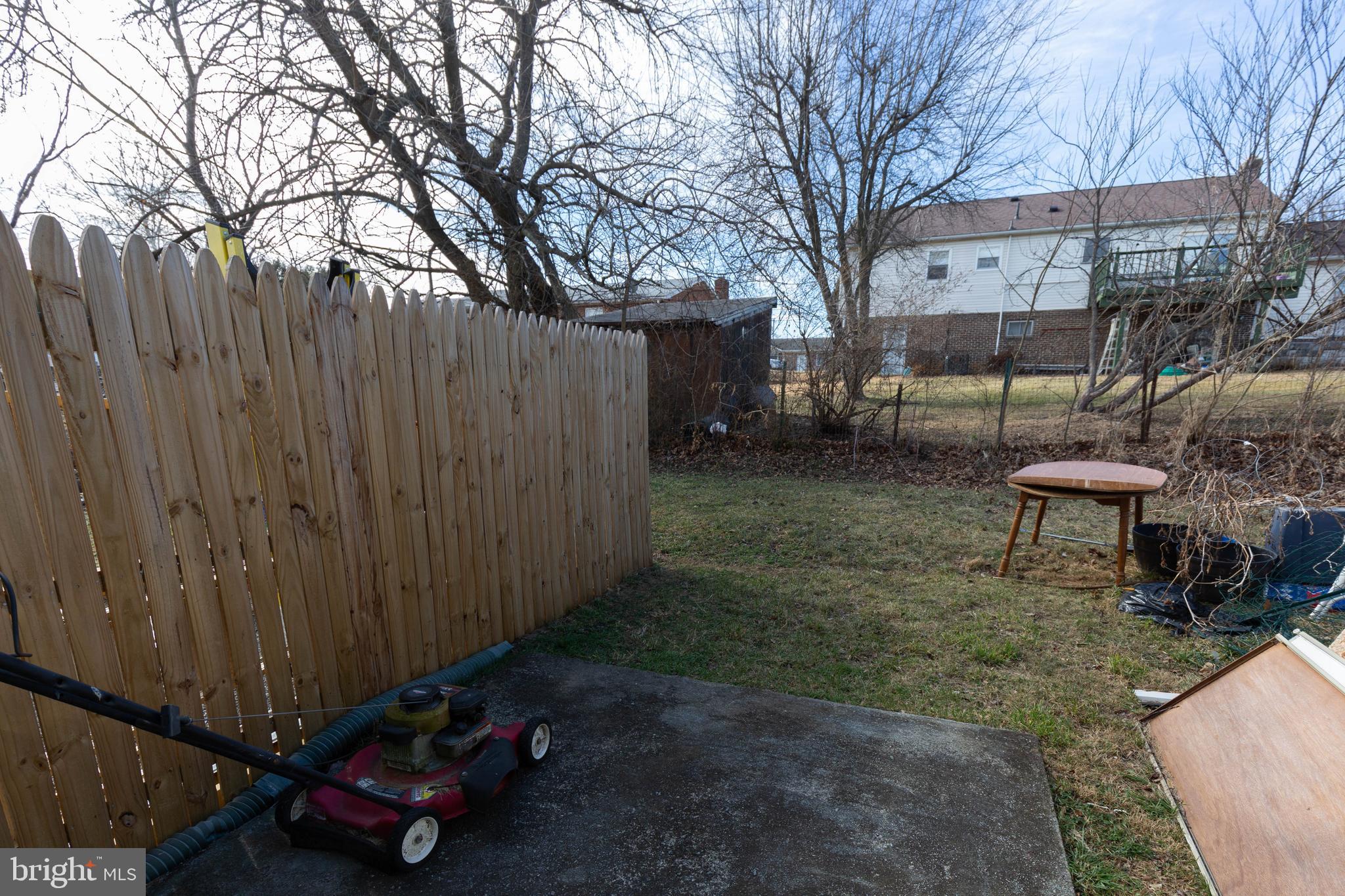 48 Turf Lane Ranson, WV 25438 - Photo 21 of 21 a backyard of a house with table and chairs