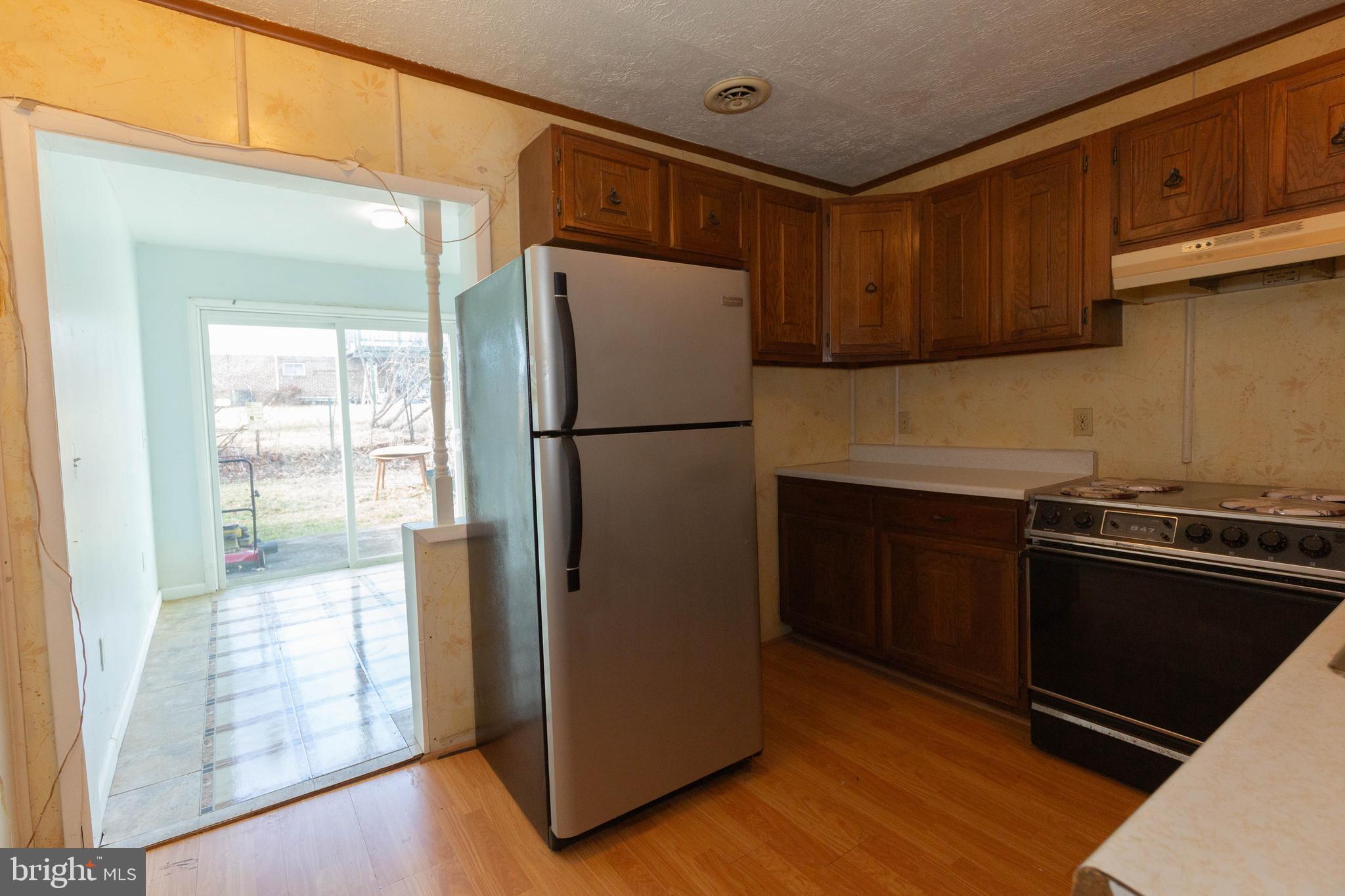 48 Turf Lane Ranson, WV 25438 - Photo 6 of 21 a white refrigerator freezer and a stove sitting inside of a kitchen