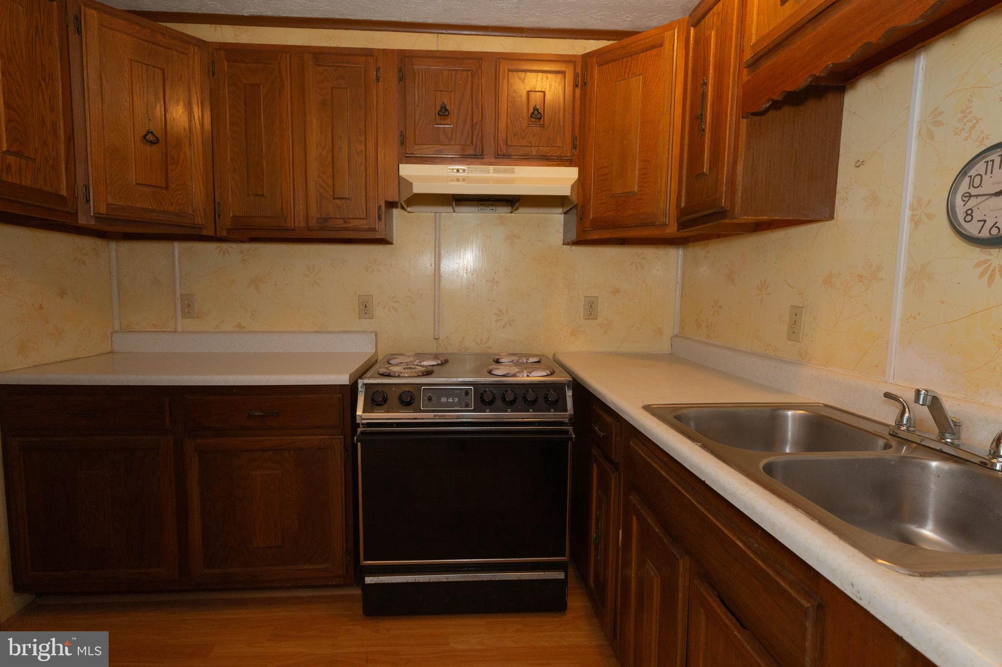 48 Turf Lane Ranson, WV 25438 - Photo 7 of 21 a kitchen with sink cabinets and stainless steel appliances