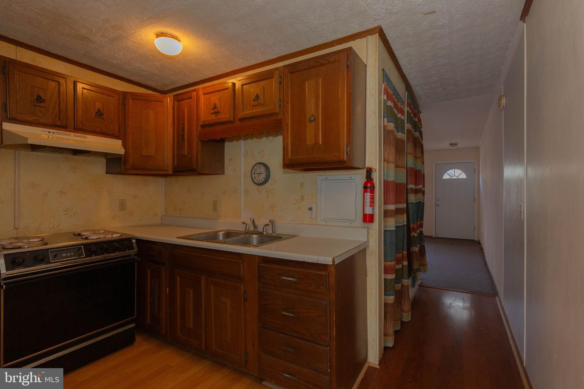 48 Turf Lane Ranson, WV 25438 - Photo 8 of 21 a kitchen with a sink and cabinets