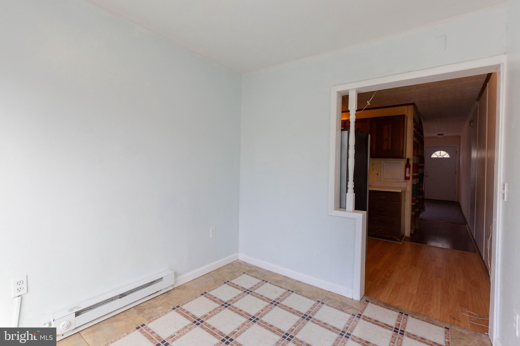 48 Turf Lane Ranson, WV 25438 - Photo 9 of 21 a view of a hallway with wooden floor and a bathroom