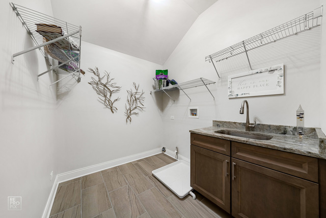 12854 Rosa Lane Lemont, IL 60439 - Photo 13 of 17 a view of a sink and cabinets in a room