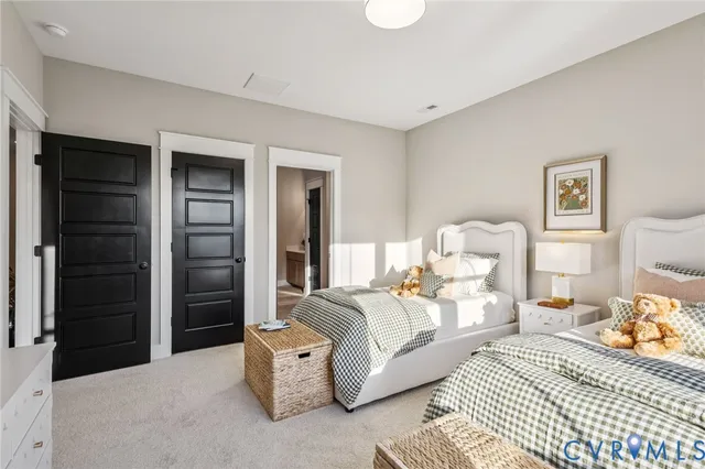 a bedroom with furniture and a lamp