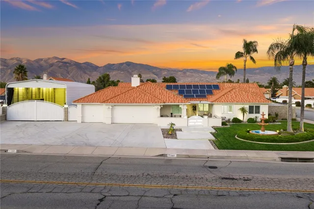 an aerial view of multiple houses with yard