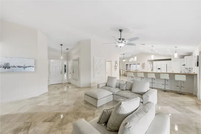a kitchen with stainless steel appliances kitchen island granite countertop a sink and cabinets