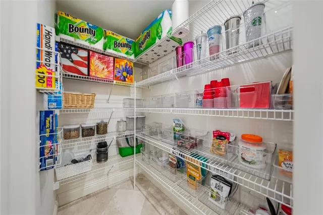 a bathroom with a granite countertop sink a toilet and a mirror
