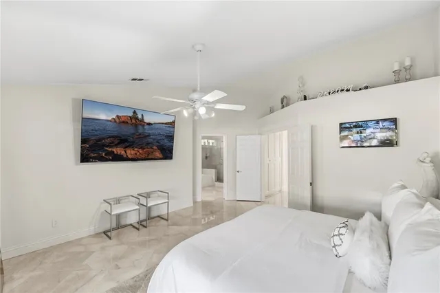 a bathroom with a double vanity sink toilet and shower