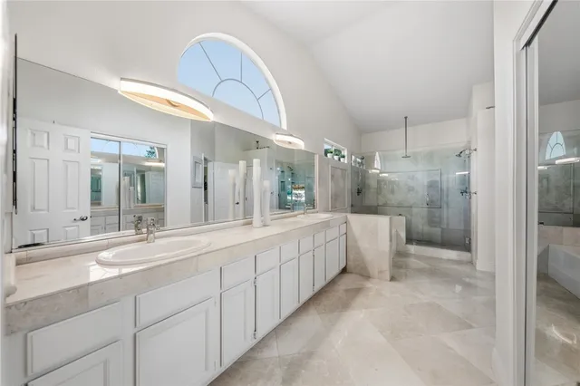 a kitchen with a refrigerator and a sink