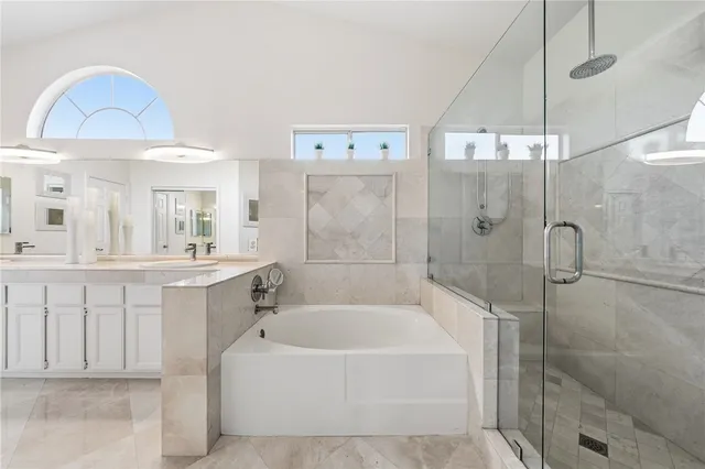 a view of a patio with a table and chairs under an umbrella