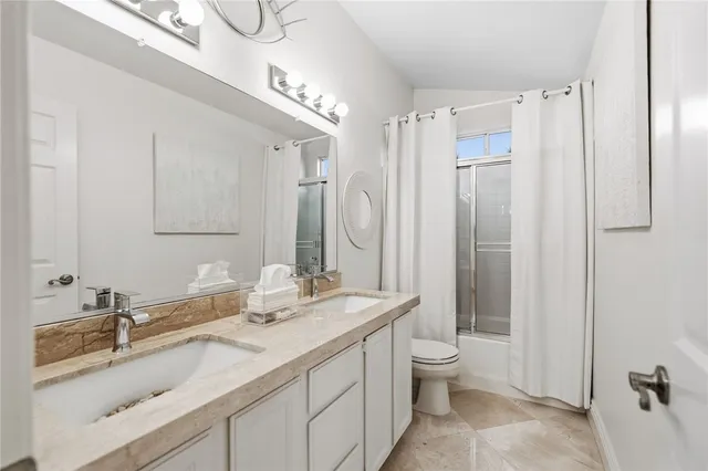 a swimming pool with outdoor seating and a patio