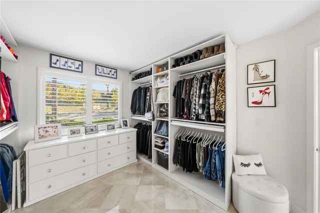 a view of a patio with table and chairs potted plants with sky view