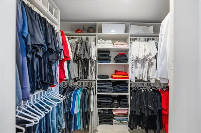 a view of a swimming pool and outdoor seating