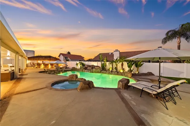 a view of living room with furniture and floor to ceiling windows