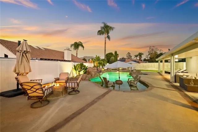 a view of a porch with hardwood and door
