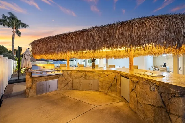 a balcony with furniture and a ceiling fan