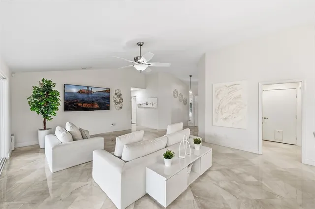 a kitchen with stainless steel appliances kitchen island granite countertop a sink and cabinets
