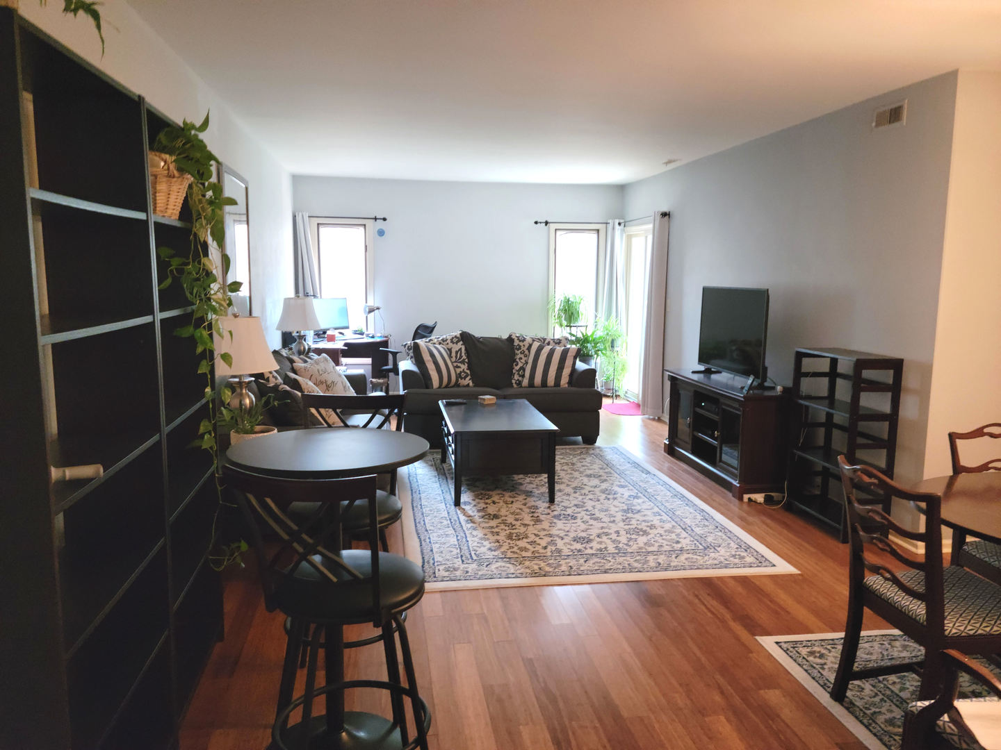 1214 Gulfstream Parkway, Unit 1 Libertyville, IL 60048 - Photo 2 of 10 a living room with furniture and a flat screen tv