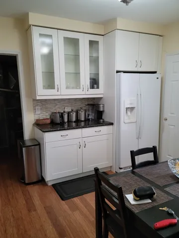 a kitchen with a sink a stove and refrigerator