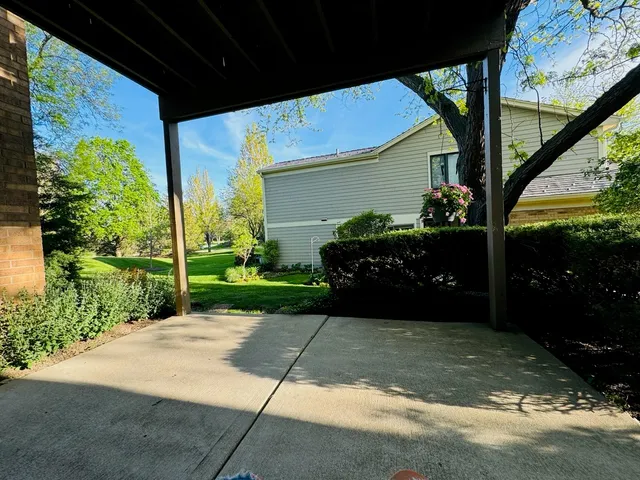 a view of a porch with potted plants