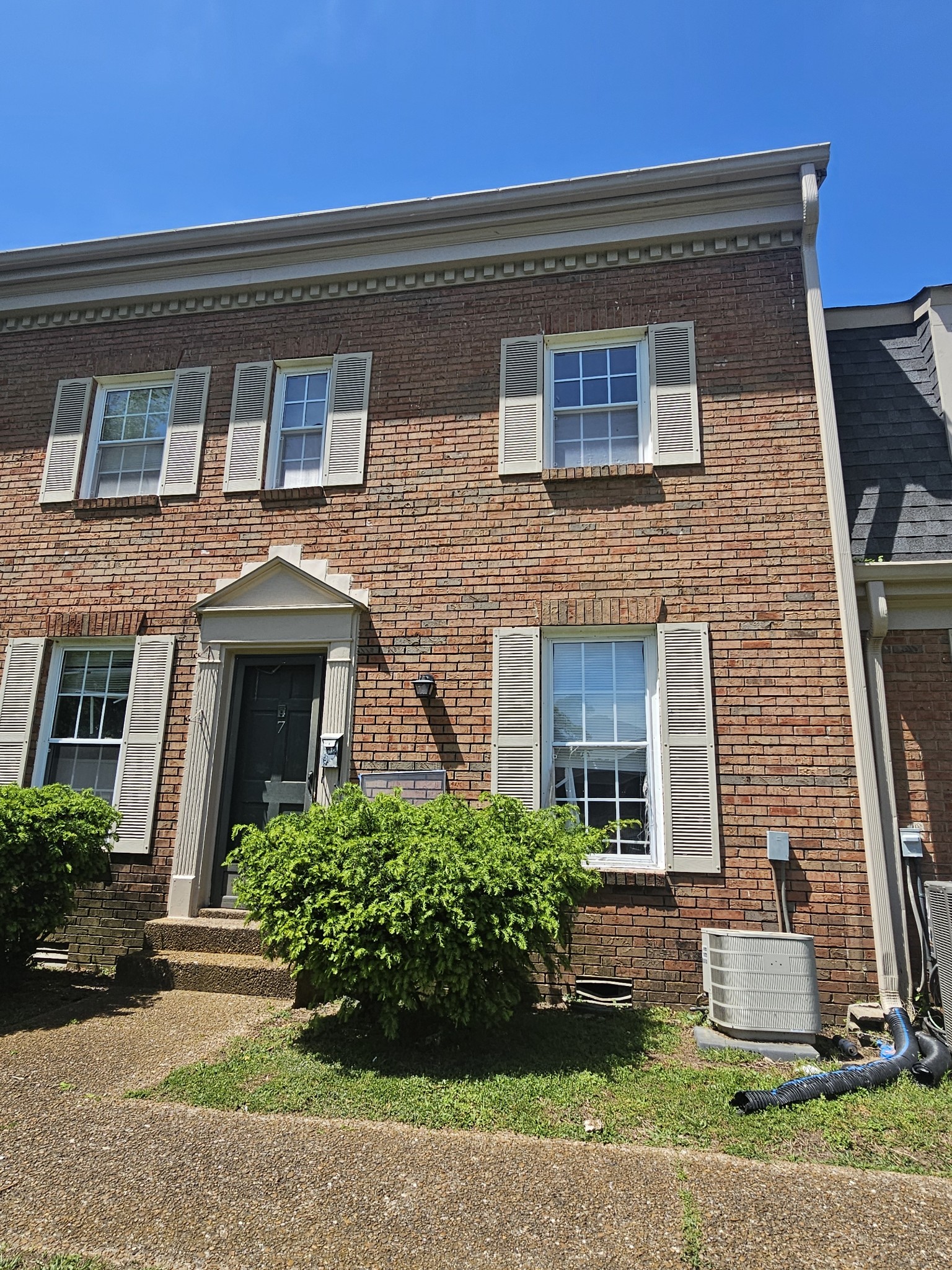 323 Forest Park Road, Unit 27 Madison, TN 37115 - Photo 1 of 12 a front view of a house with garden