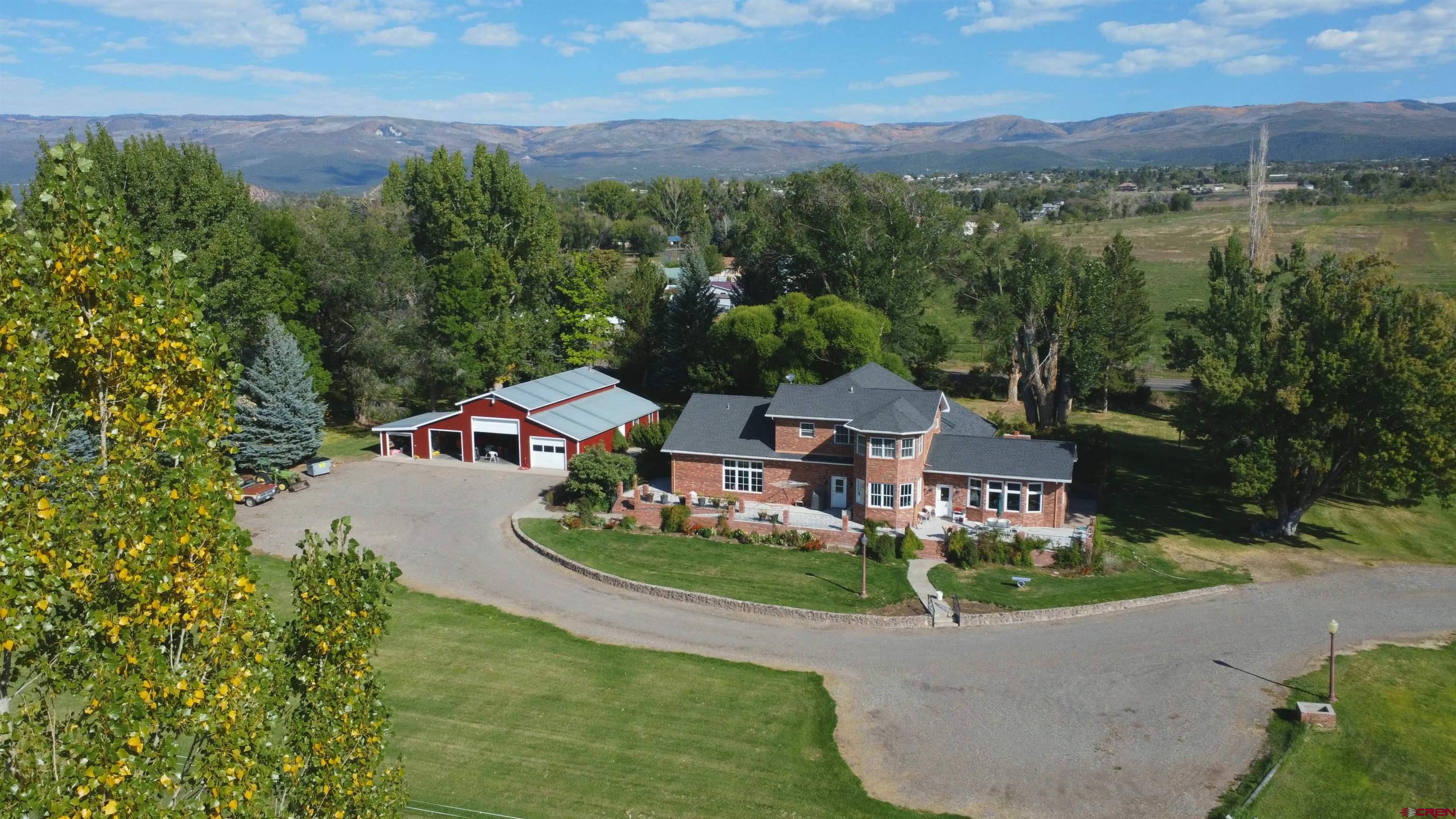633 East Main Street Cedaredge, CO 81413 - Photo 11 of 32 an aerial view of a house with outdoor space and lake view