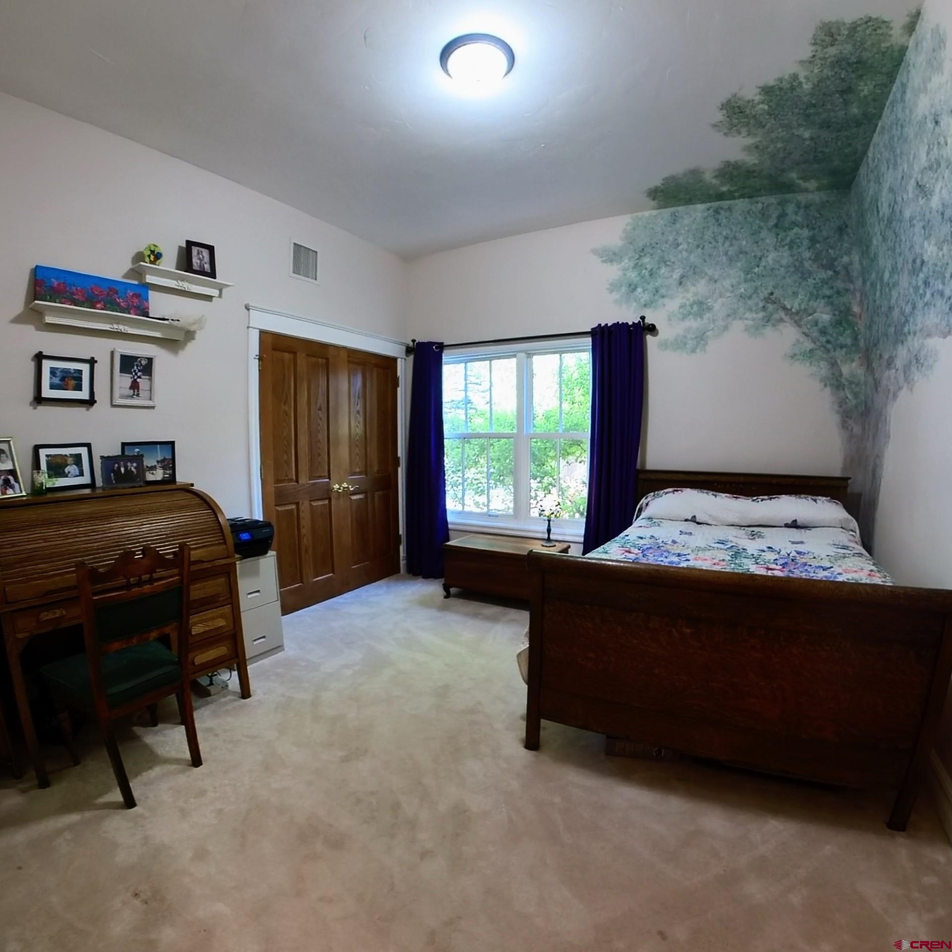 633 East Main Street Cedaredge, CO 81413 - Photo 14 of 32 a bed room with a bed and a window