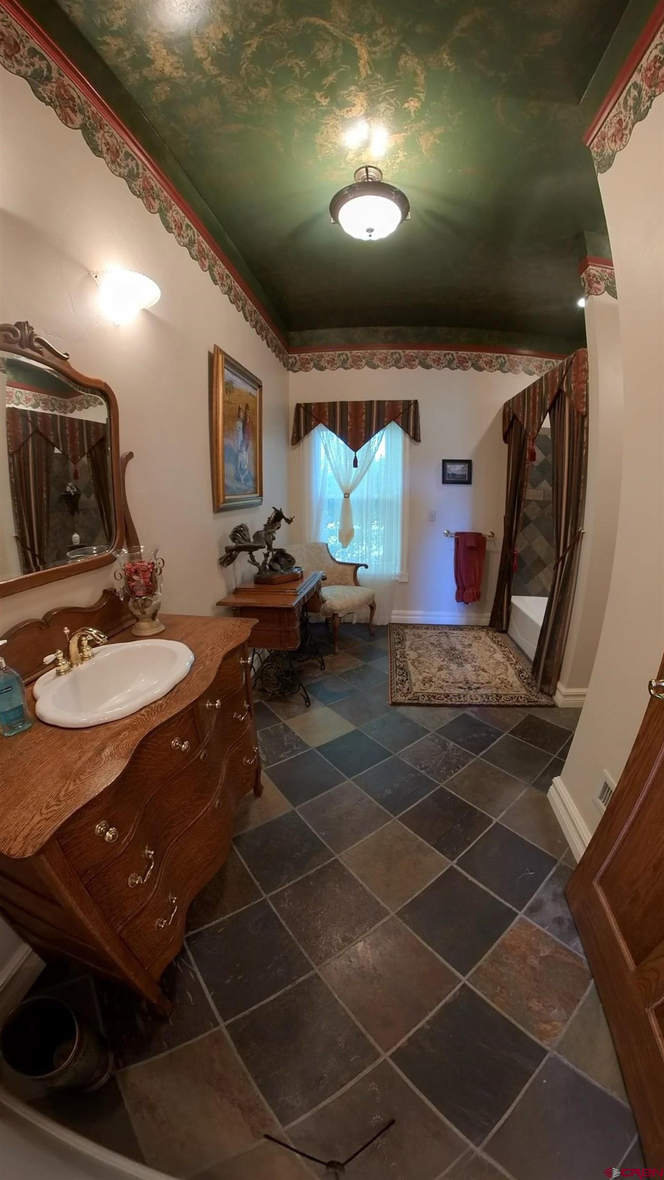 633 East Main Street Cedaredge, CO 81413 - Photo 15 of 32 a living room with patio furniture and a sink