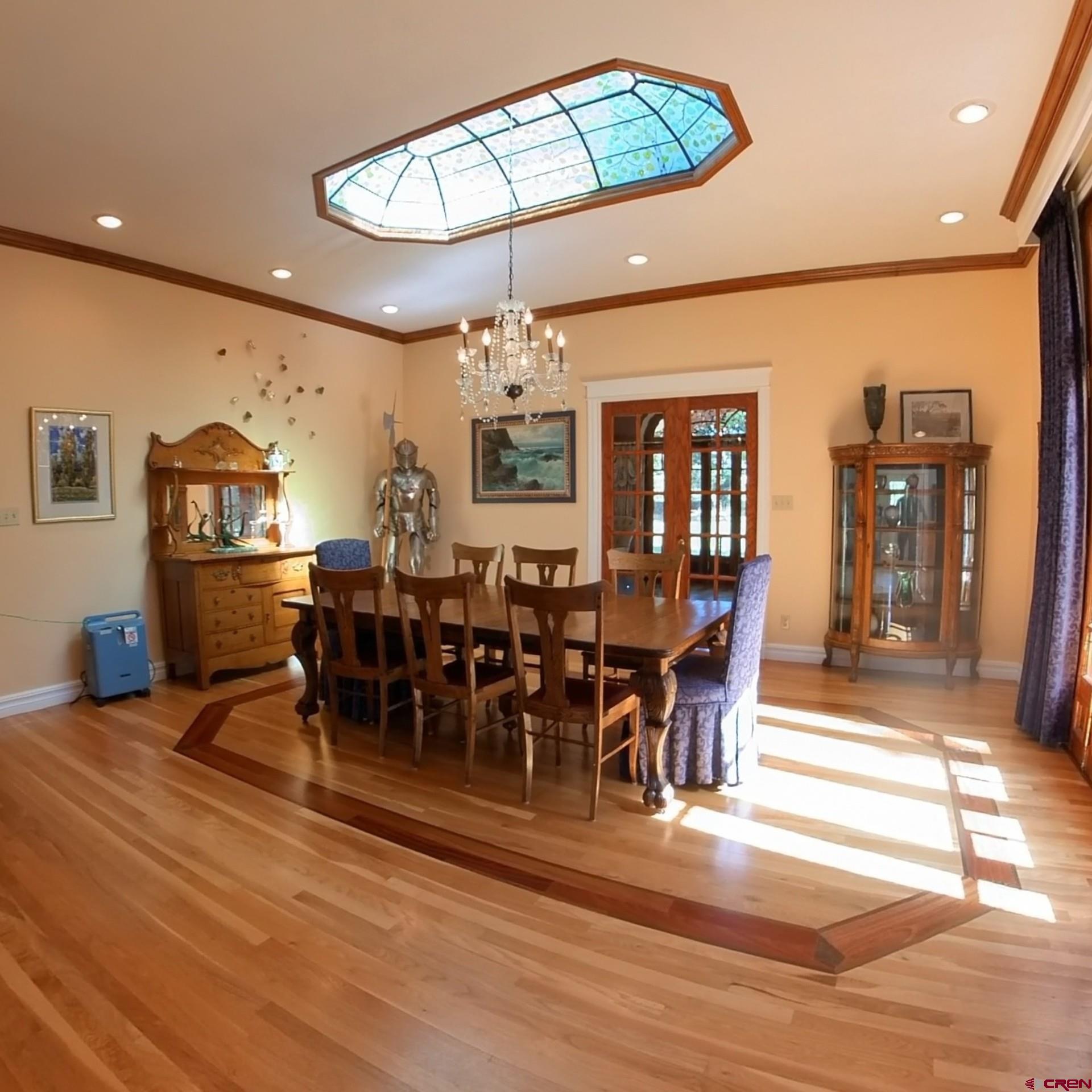 633 East Main Street Cedaredge, CO 81413 - Photo 16 of 32 a view of a dining room with furniture wooden floor and chandelier