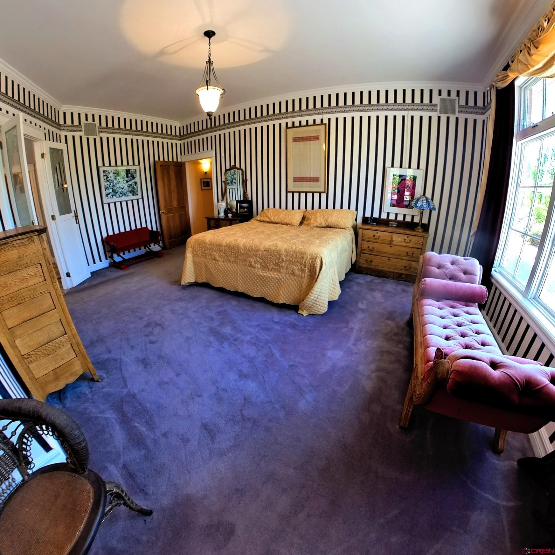 633 East Main Street Cedaredge, CO 81413 - Photo 18 of 32 a bedroom with furniture and a window