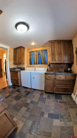 a kitchen with a stove a sink and a microwave