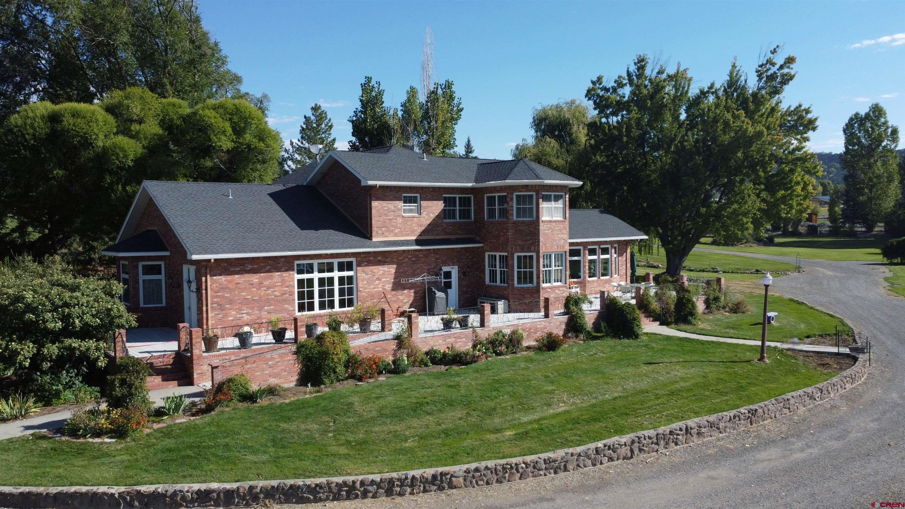 633 East Main Street Cedaredge, CO 81413 - Photo 2 of 32 front view of a house with a yard