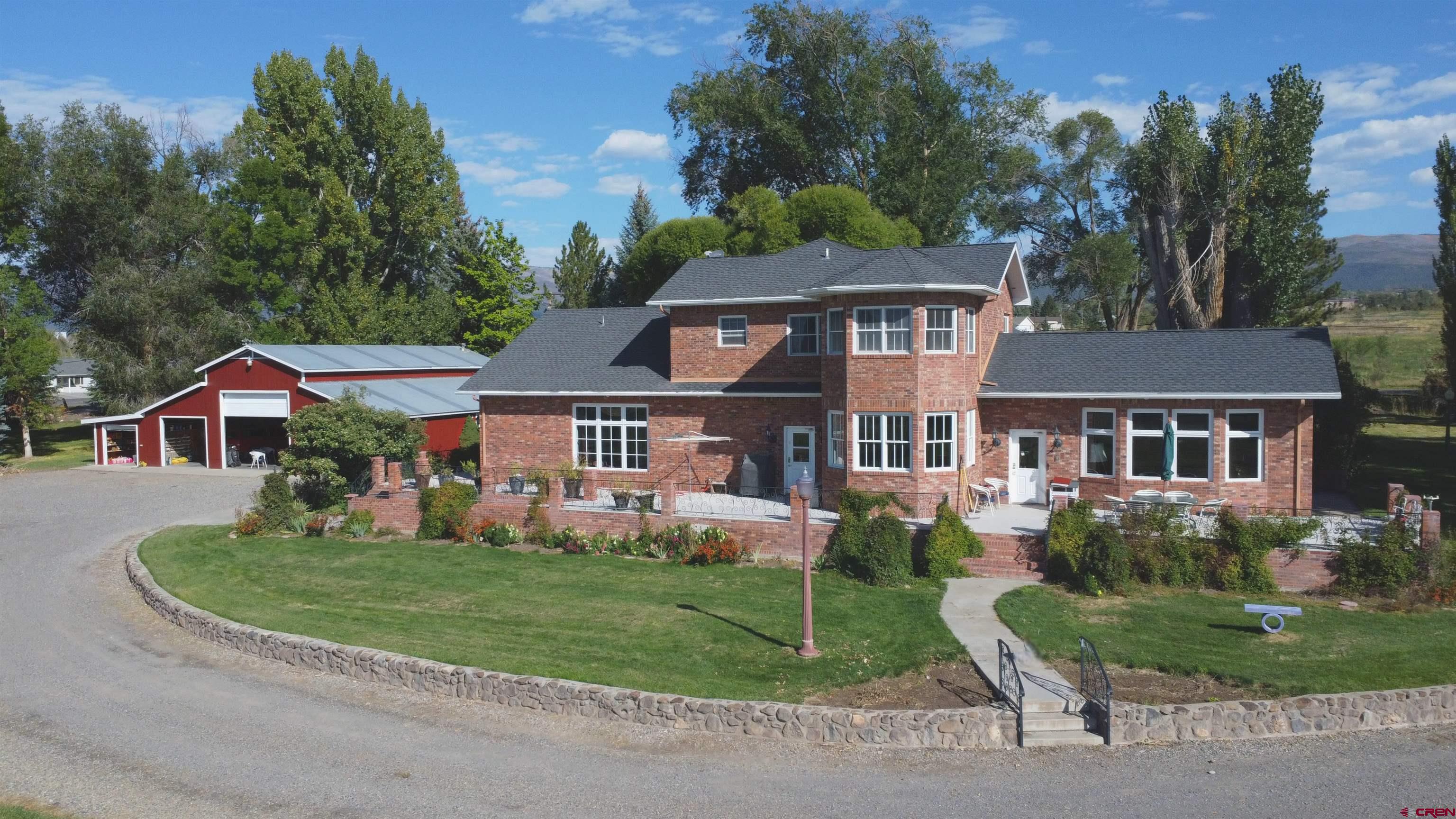 633 East Main Street Cedaredge, CO 81413 - Photo 21 of 32 front view of a house with a yard