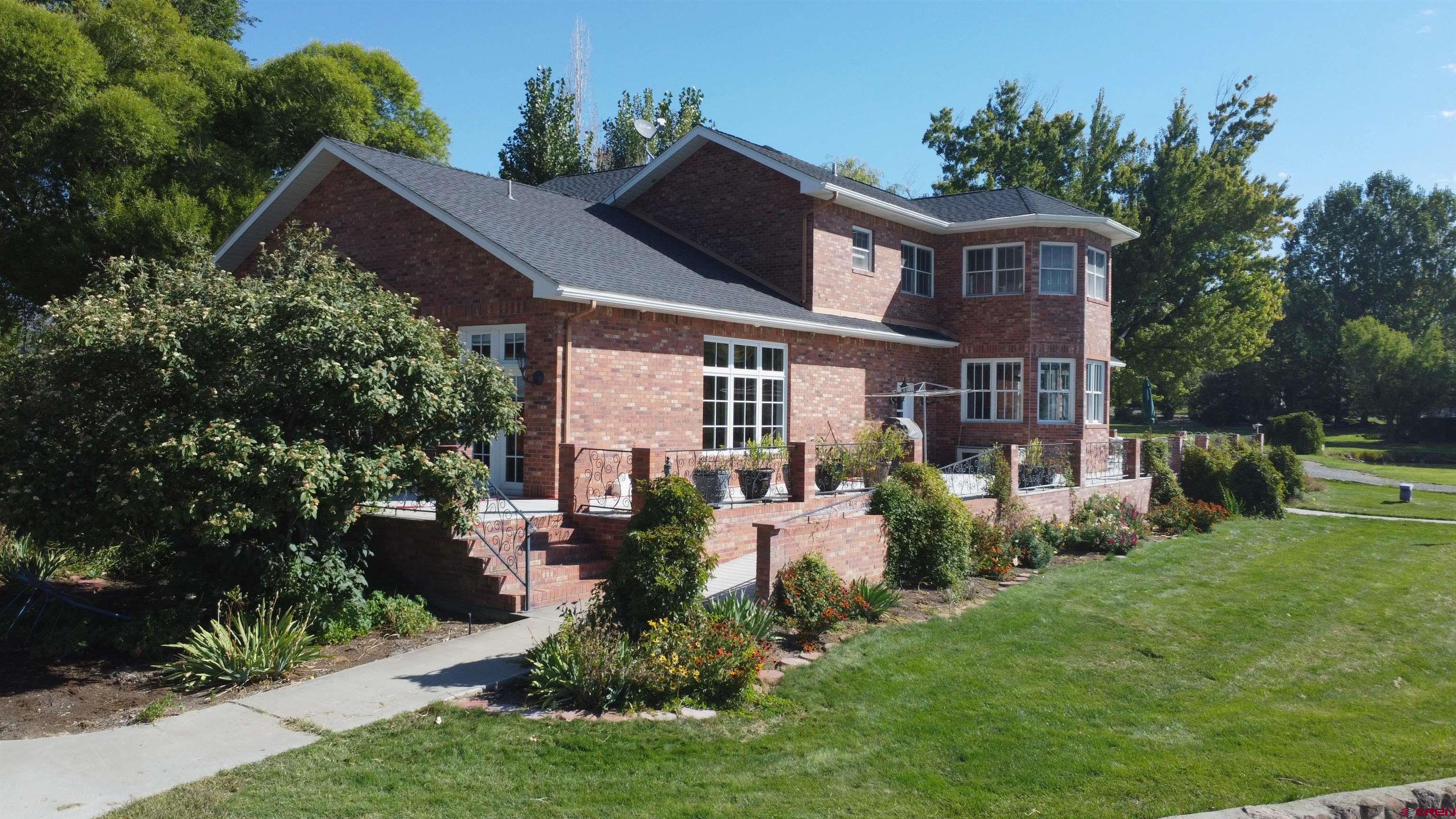 633 East Main Street Cedaredge, CO 81413 - Photo 22 of 32 a view of a house with a garden