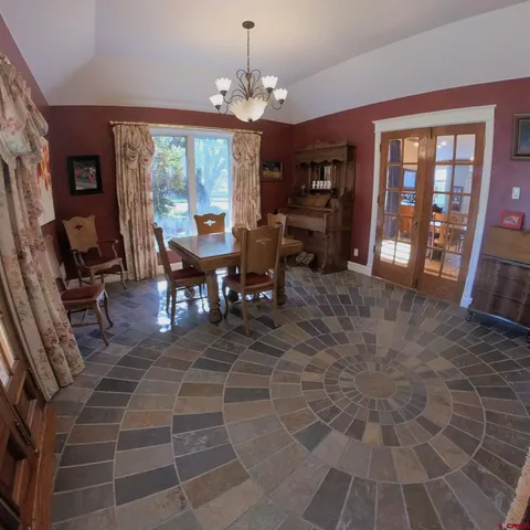 a view of a dining room with furniture window and outside view