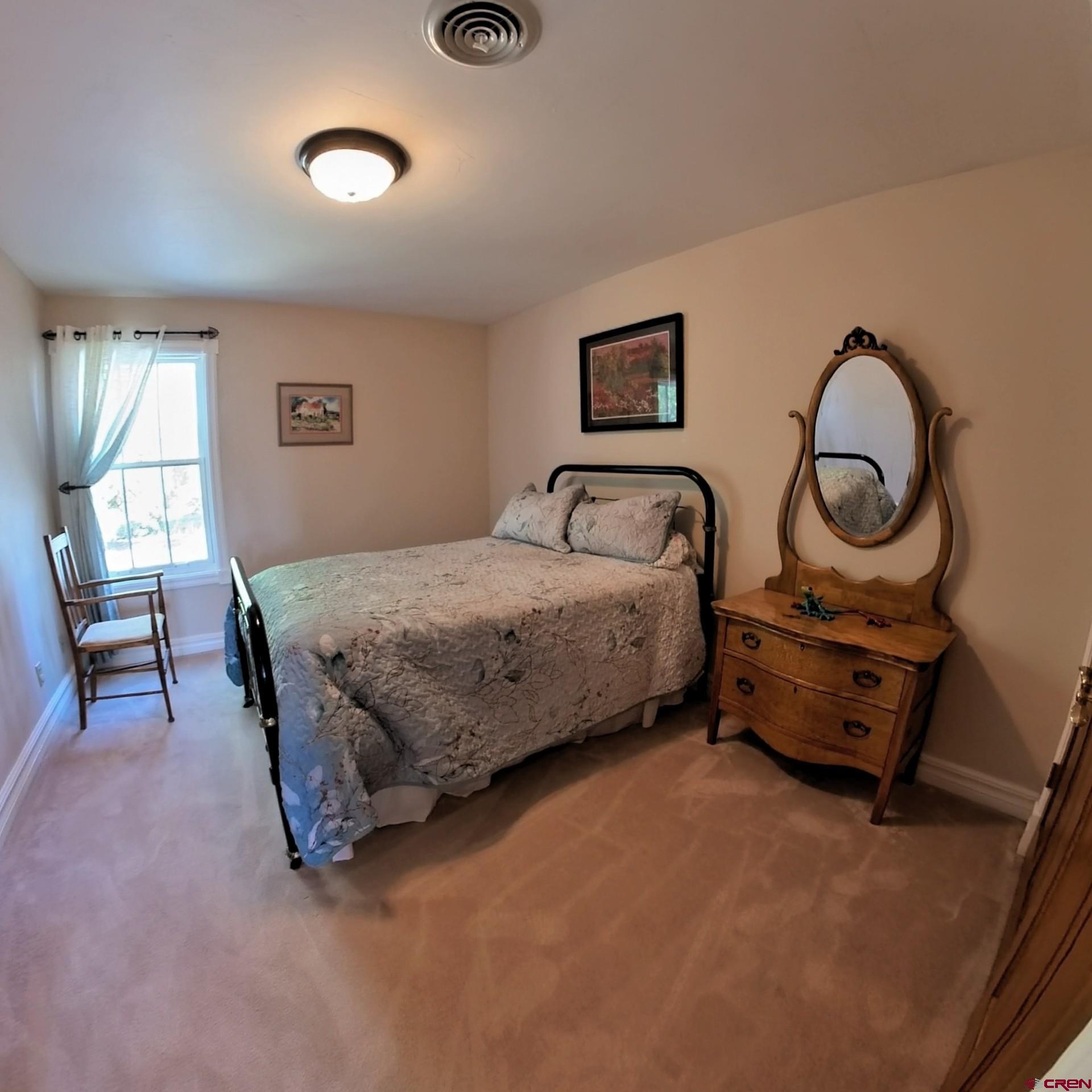633 East Main Street Cedaredge, CO 81413 - Photo 28 of 32 a bedroom with bed and a window