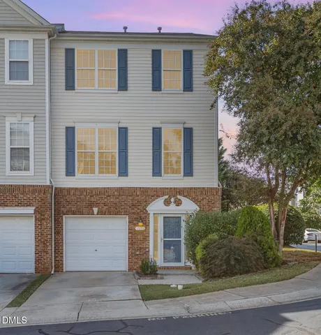 a front view of a house with yard
