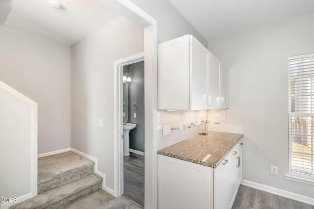 a kitchen with a sink and a refrigerator