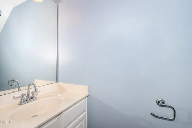 a bathroom with a sink and vanity