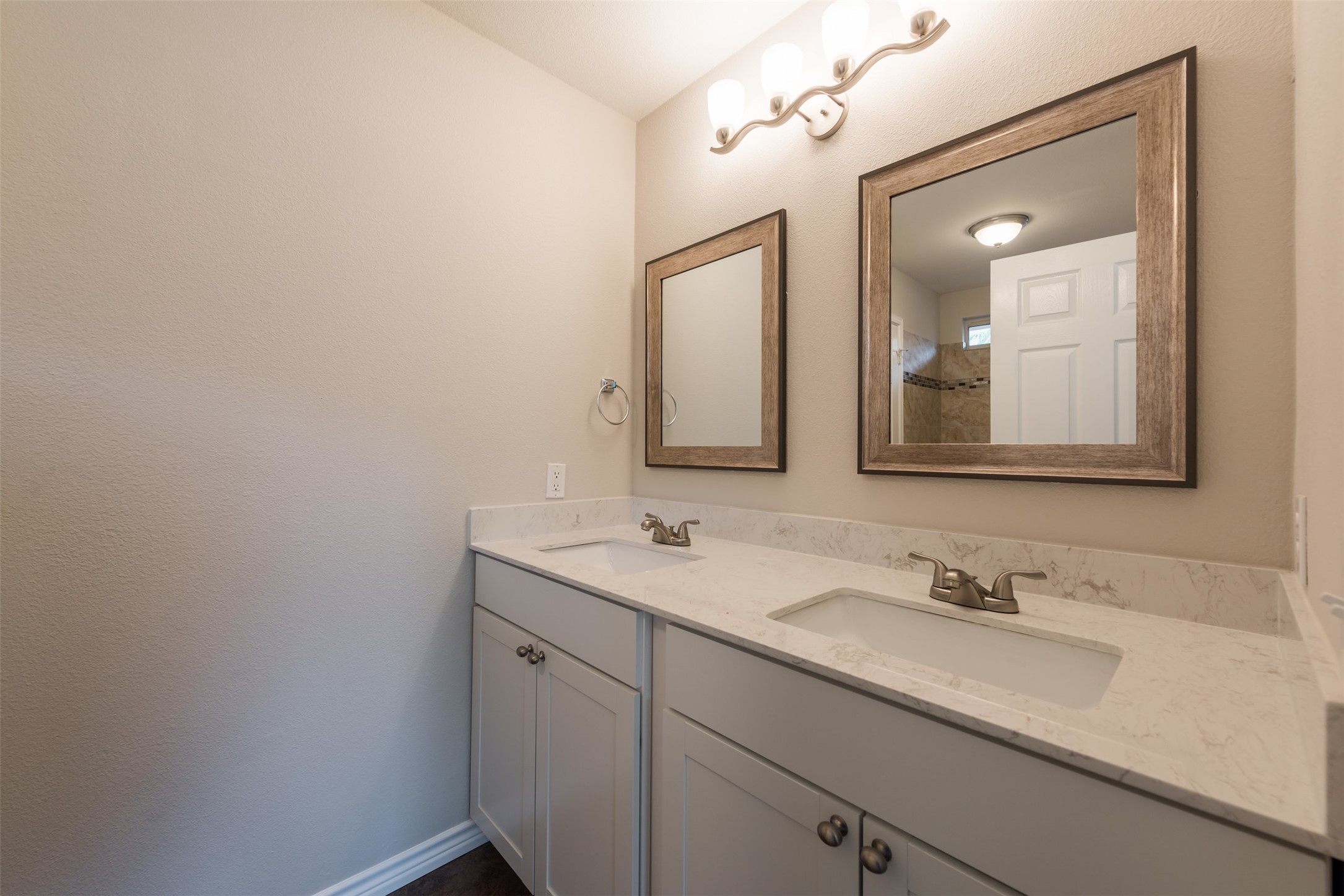 5703 Teri Road Austin, TX 78744 - Photo 10 of 16 a bathroom with a sink and a mirror