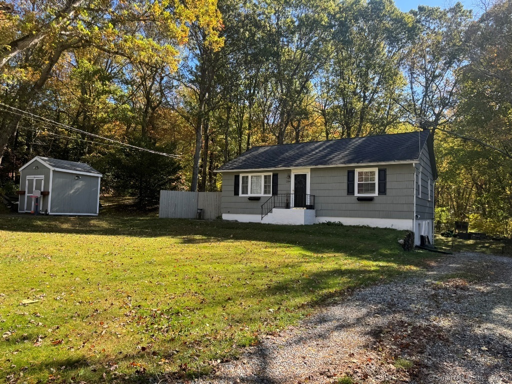 a house view with swimming pool in front of it