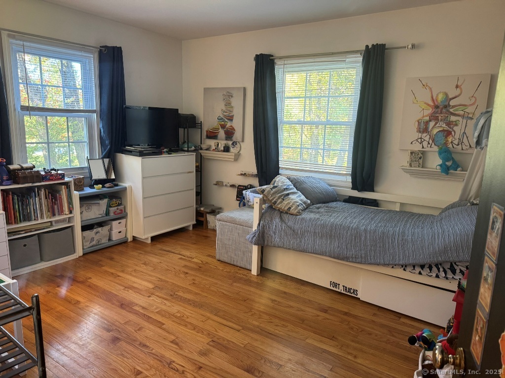 1166 Spindle Hill Road Wolcott, CT 06716 - Photo 12 of 29 a living room with furniture and a flat screen tv